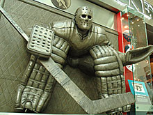 The larger-than-life statue honouring Ken Danby's 'At The Crease' painting outside the Spirit of Hockey Store