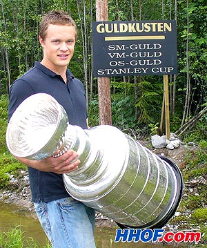 Anaheim Ducks centre Samuel Pahlssson poses with the Stanley Cup at his summer home in Sweden