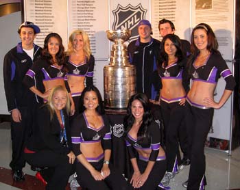 Members of the LA Kings Ice Crew pose for a photo with the Stanley Cup during draft weekend in Los Angeles.