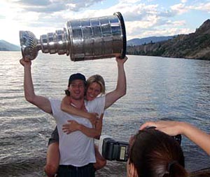 Duncan Keith and his fiance having some fun with the Stanley Cup