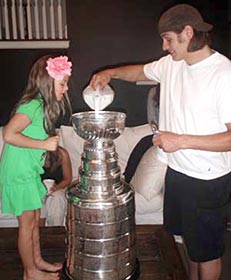 Brent Sopel and family about to enjoy some cereal from the bowl of the Stanley Cup