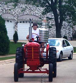 Brent Sopel and the Stanley Cup out for a drive through the streets of Hinsdale on his restored family tractor