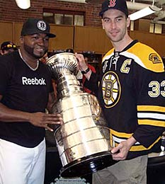 Bruins captain Zdeno Chara and Boston Red Sox player David Ortiz with Lord Stanley