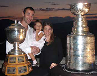 Zdeno Chara along with his wife Tatiana and their daughter Elliz sharing a moment with the Stanley Cup and Norris Trophy at the Trencin Castle.