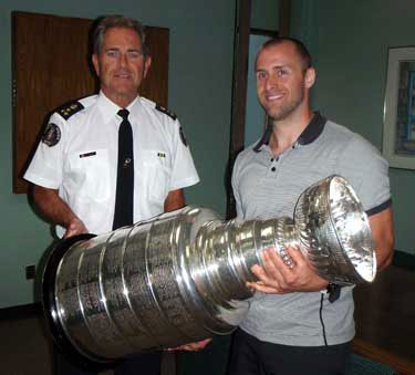 Rich Peverley and Chief Robert Davis of the Guelph Police Department.