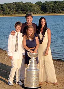 Cam Neely and family posing for photos with Lord Stanley while spending time at Martha's Vineyard.