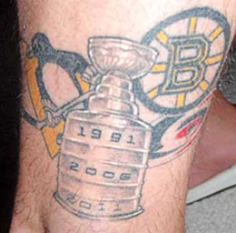 Mark Recchi showing off his Stanley Cup tattoo.