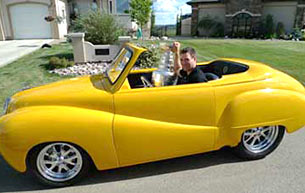 Johnny Boychuk and the Stanley Cup getting some photos with a 1952 Astin Martin.