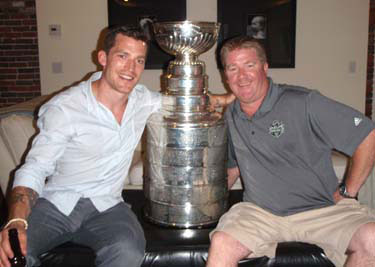 Stanley Cup 'Keeper' Mike Bolt and Andrew Ference of the Boston Bruins in Boston, MA.