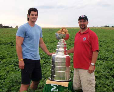 Stanley Cup 'Keeper' Walt Neubrand and Adam McQuaid of the Boston Bruins in P.E.I.