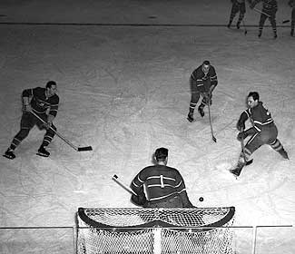 Bill Durnan warming up with his Montreal teammates, some of the league's best shooters.