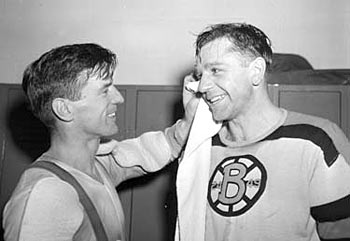 Frank Brimsek and Woody Dumart of the Boston Bruins sharing a laugh.