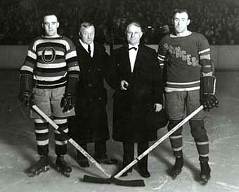 Bill Cook and King Clancy taking part in a pre-game ceremony with NHL President Frank Calder