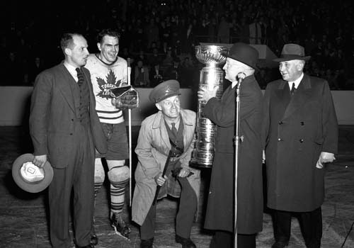 Syl Apps and Conn Smythe celebrating during the Stanley Cup presentation in 1942.