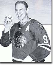 Bobby Hull holds a souvenir puck from his 51st goal