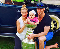 Bryan, Amanda and Makayla Bickell pose for a family photo with the Stanley Cup.