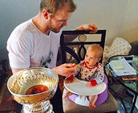 In Newtonville, Ontario, Bryan Bickell feeds daughter, Makayla from the Stanley Cup.