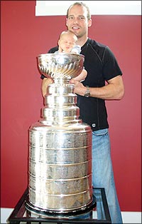 Carolina Hurricanes rookie Andrew Hutchinson and son Cole