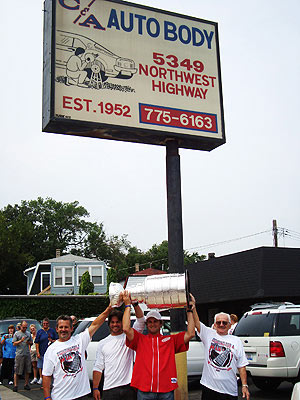 Brett Lebda and the Stanley Cup at his father's body shop