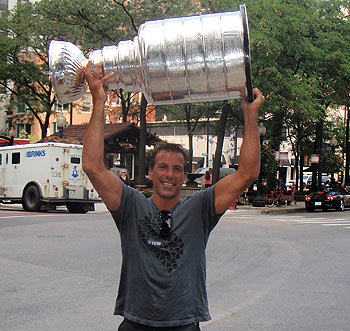 Chris Chelios and the Stanley Cup walk downtown Chicago en route to Gibson's Steakhouse.