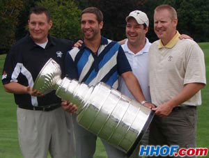 Maxime Talbot poses for a photo with the Stanley Cup and members of his foursome during the Penguins golf tournament.