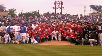 Members of the Hawks, Cubs and White Sox pose for a group photo with the Stanley Cup.