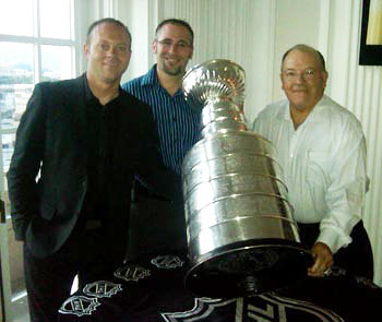 Blackhawks General Manager Stan Bowman with father Scotty Bowman sharing a moment with the Stanley Cup.