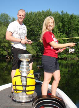 Bryan Bickell fishing on the Otonabee River with his girlfriend Amanda and the Stanley Cup.