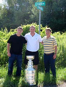 Ben Eager and the Stanley Cup sharing a moment with his father and brother