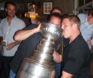 Ben Eager enjoying a drink from Lord Stanley's mug