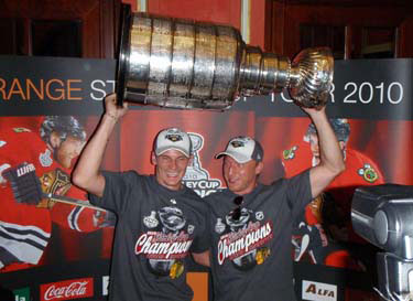 Tomas Kopecky and Marian Hossa showing off the Stanley Cup at a media conference in Bratislava.
