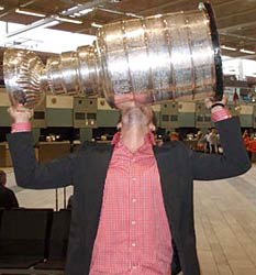 The Stanley Cup arrives at the Gothenburg airport and is greeted by Niklas Hjalmarsson