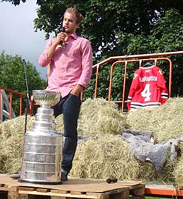 Niklas Hjalmarsson speaks to the crowd during his day with the Stanley Cup in Russnas, Sweden.