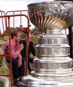 The Stanley Cup looks on as Niklas Hjalmarsson answers questions during his day with the Stanley Cup in Russnas, Sweden.