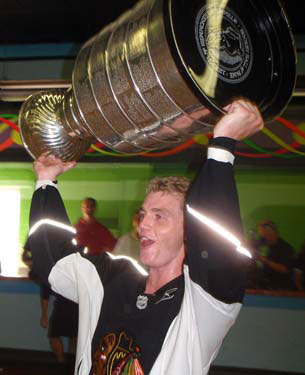 Patrick Kane hoisting Lord Stanley following his team's floor hockey win at DJ Spinners.
