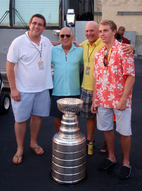 Patrick Kane and the Stanley Cup posing for a photo with Jimmy Buffett prior to his concert at Toyota Park in Chicago.