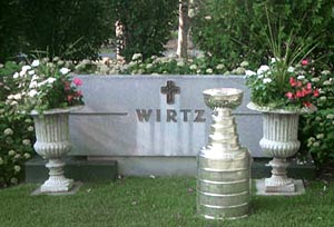 The Stanley Cup in front of the Wirtz family burial site