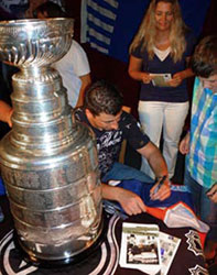 Tomas Kaberle signing some autographs for fans at a the town hall of Velka Dobra