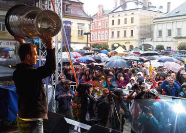 David Krejci proudly hoisting the Stanley Cup in front fans at the town square in Sternberk, Czech Republic.