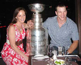 Shawn Thornton and wife Erin sharing a moment with the Stanley Cup at 360 The Restaurant at the CN Tower.