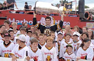Adam McQuaid sharing his day with Lord Stanley and members of the North River Minor Hockey Association.
