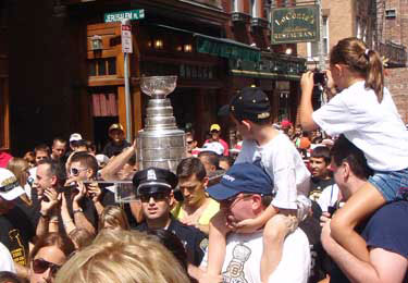 Andrew Ference and the Stanley Cup taking part in the Saint Anthony's Feast Parade.