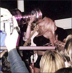 Pamela Anderson drinks from the Stanley Cup