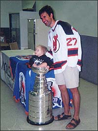 Pamela Anderson drinks from the Stanley Cup