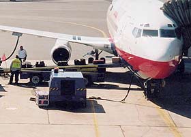 The Stanley Cup sits to the side of the aircraft before boarding for yet another destination.