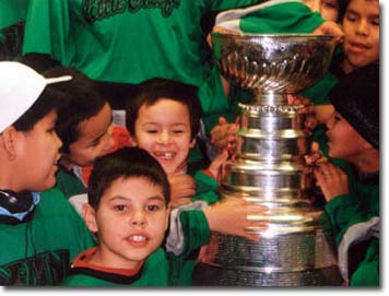 Children welcome the Stanley Cup.