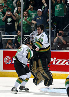 Adam Dennis #28 of the London Knights leaps into the arms of Bryan Rodney #74 as they celebrate their 4-0 victory over the Rimouski Oceanic in the Memorial Cup final at the John Labatt Centre, London, Ontario.