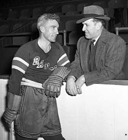New York Ranger player Neil Colville chats with head coach Frank Boucher