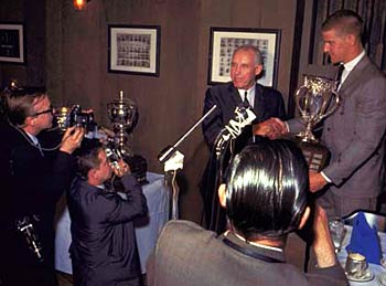 Clarence Campbell presenting the Calder Memorial Trophy to Boston Bruin Bobby Orr in 1967.