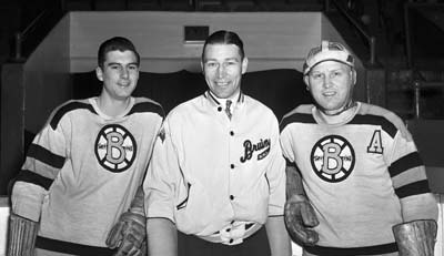 Dit Clapper along with two of his Boston Bruins players.